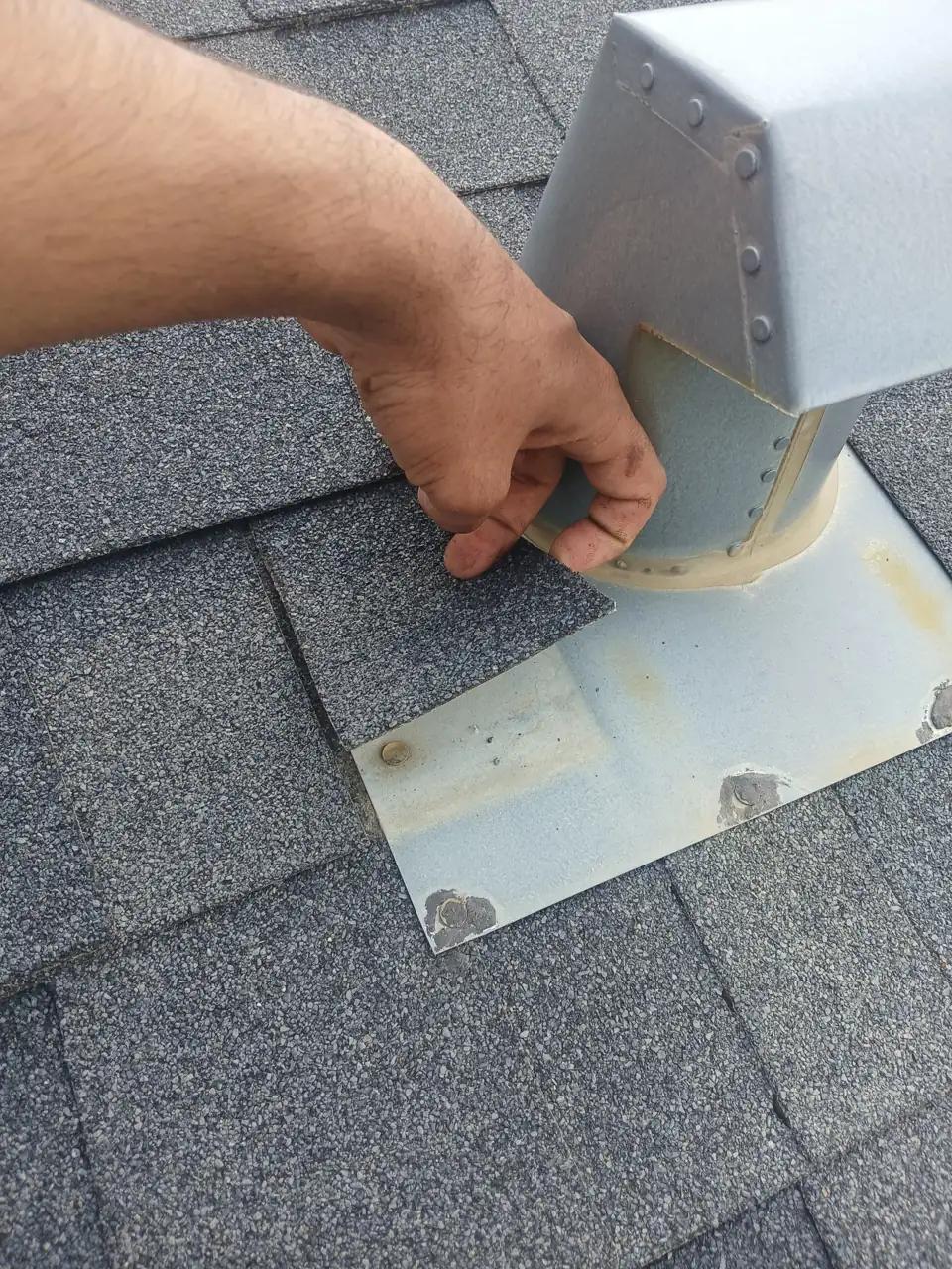 Shingle roof on an Edmonton home being inspected for leaks