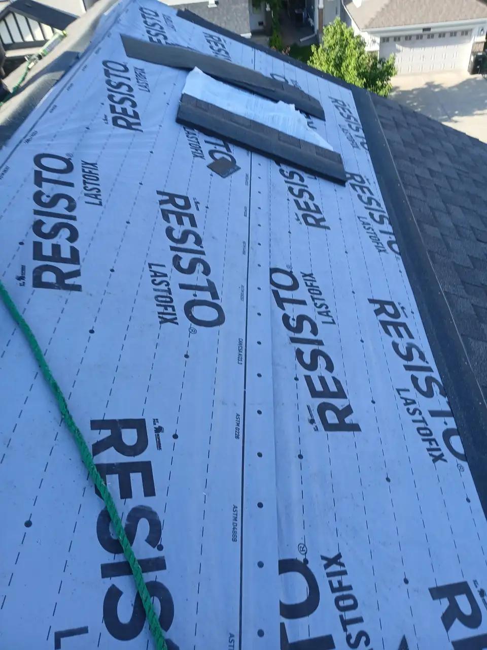 Roof replacement in progress with RESISTO underlayment and new shingles on an Edmonton home