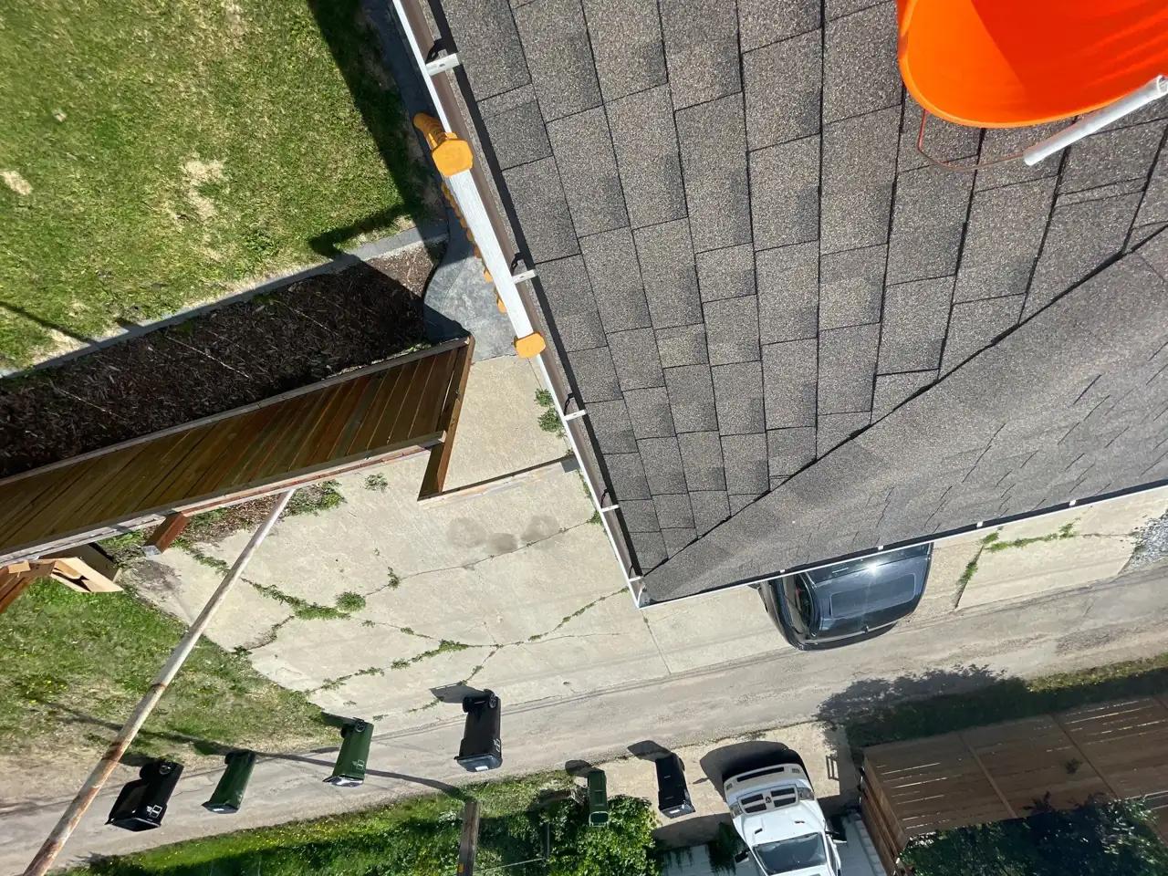 Cleared gutters and downspouts along the roofline of an Edmonton home
