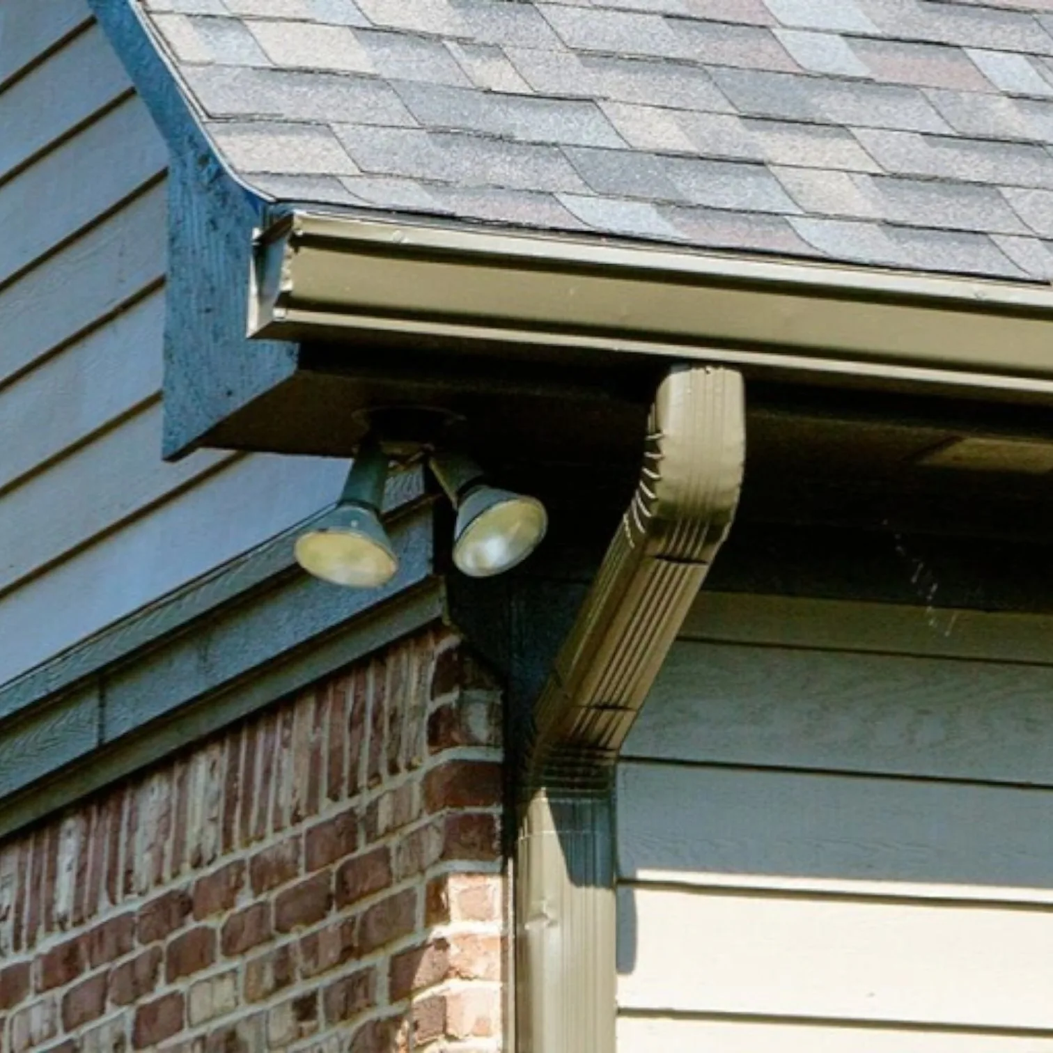 Gutter and downspout installation on a residential home