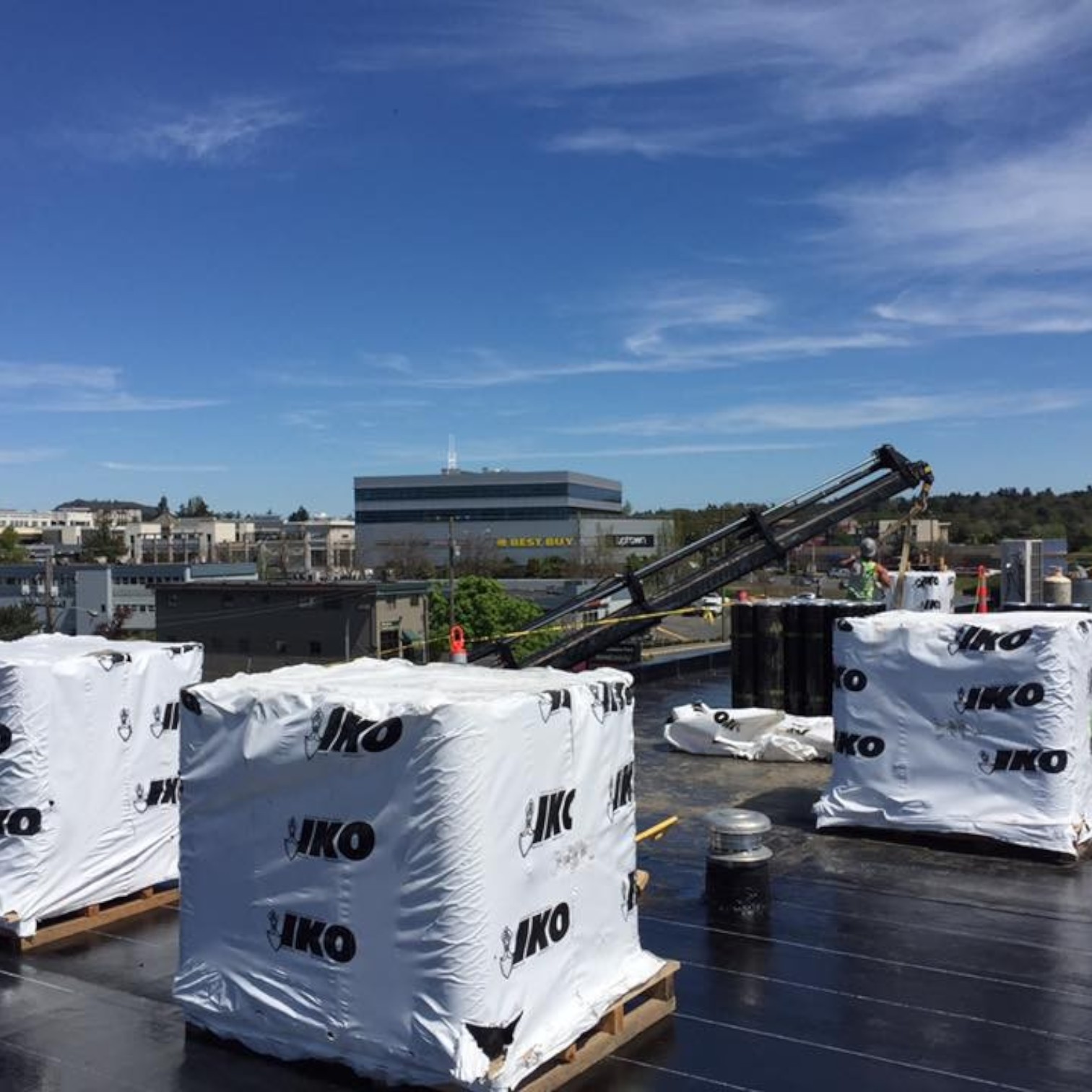 IKO commercial roof replacement materials staged on a flat roof in Edmonton