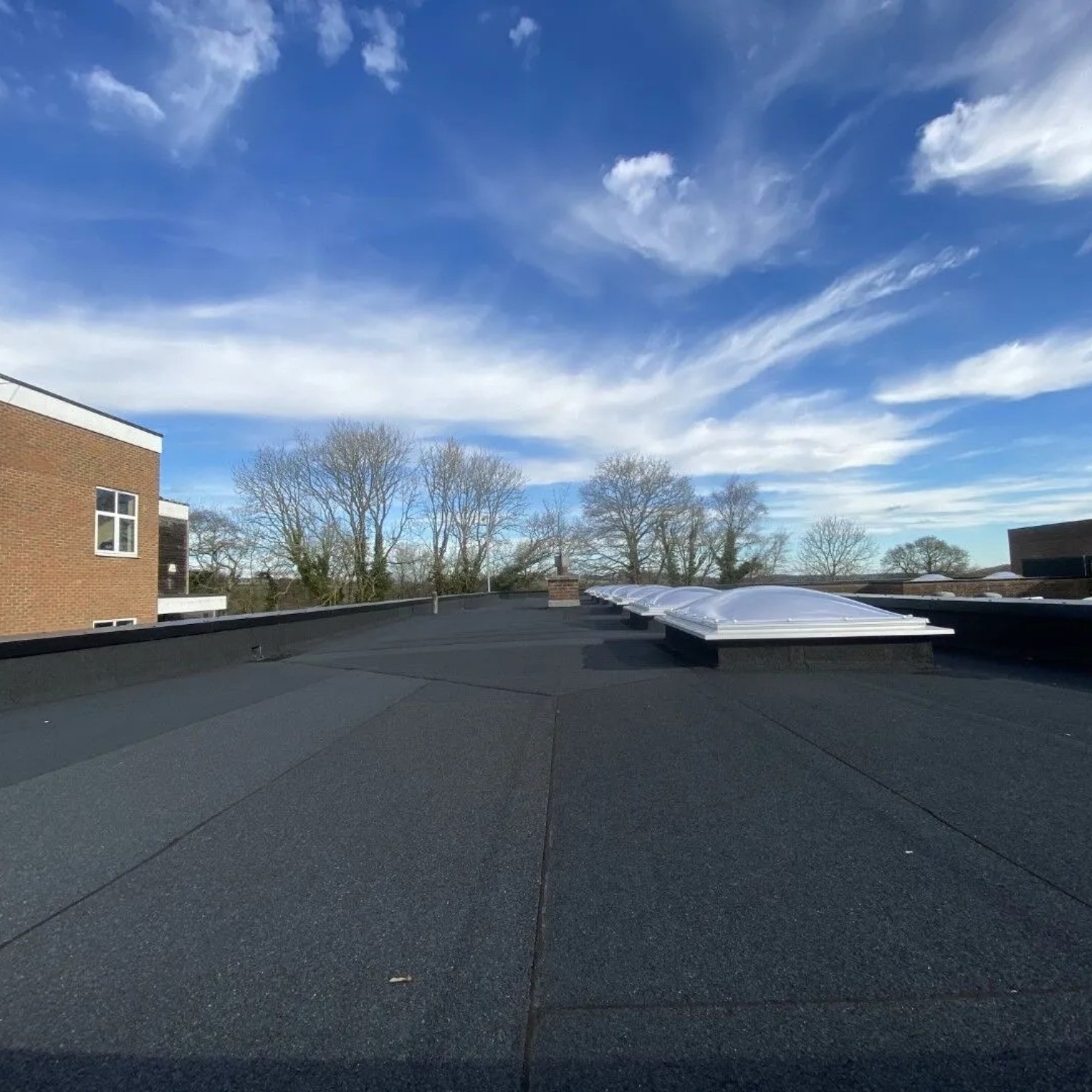 Flat roofing system installed on a low-slope roof in Edmonton